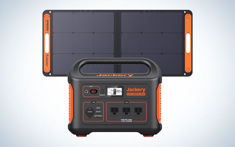 A Jackery 1000 solar generator and 100W solar panel on a plain background