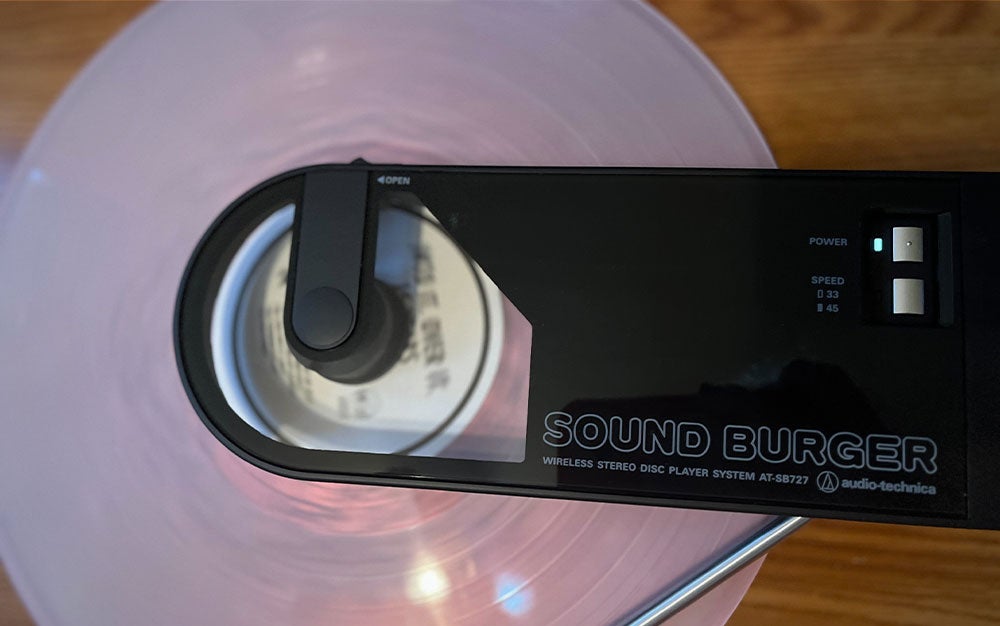 A pink Into It. Over It. recordin playing on an Audio-Technica Sound Burger